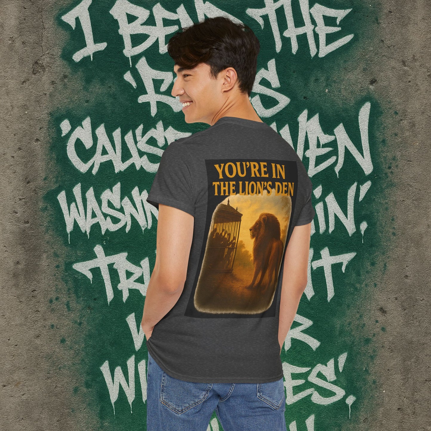 (Heavy Tee) Never Bow Co “You’re in the Lion’s Den” Graphic Streetwear Tee | Step into the Lion’s Den. Fearless statement piece built for warriors who refuse silence. Heavy cotton, bold graphic, courtroom grit. Wear strength, fight truth, and Never Bow.